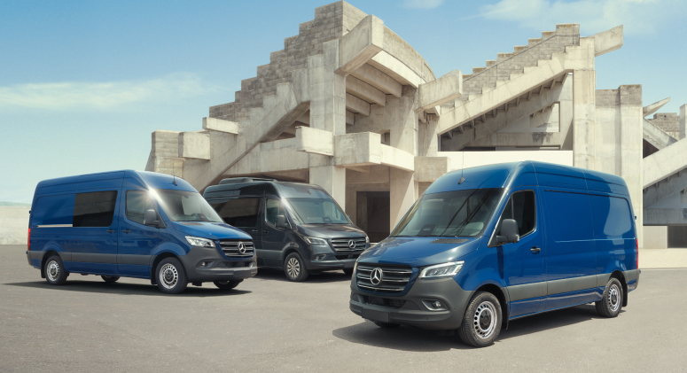 Two Mercedes-Benz vans in a warehouse.